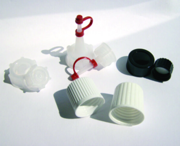 Moulded plastic caps, melamine, for square bottles series 310